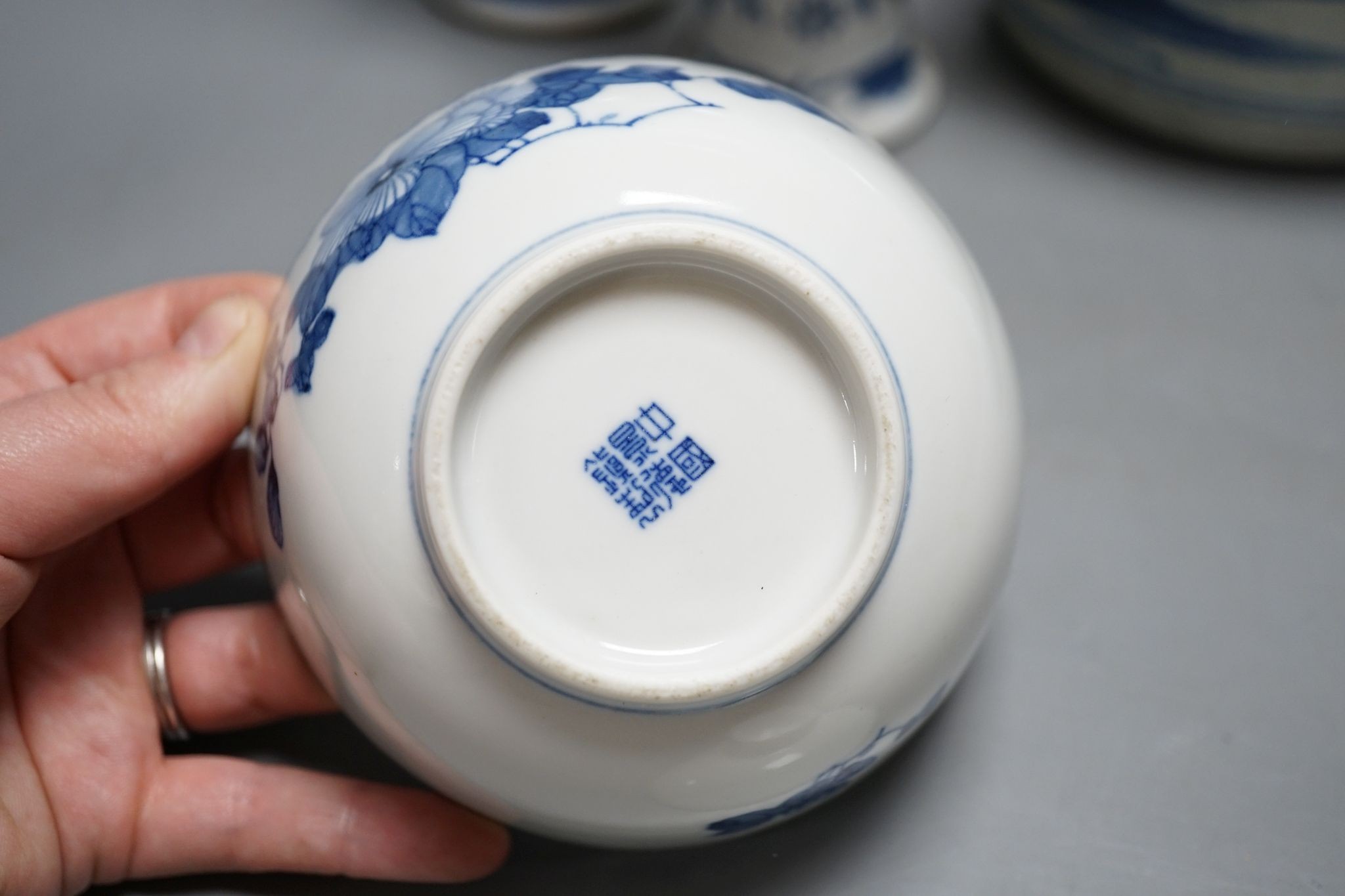 Twelve pieces of 19th century Chinese blue and white tableware and a small famille rose bowl, largest 20cm